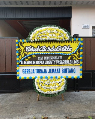 Papan Bunga Duka di Benai